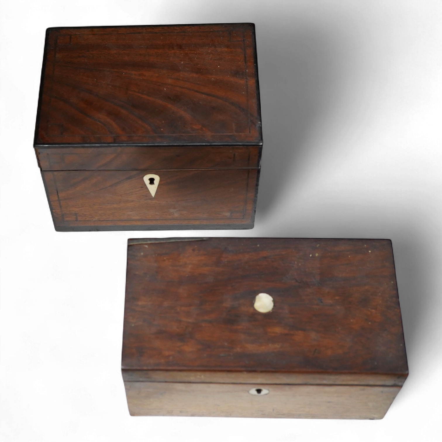Two 19th century mahogany tea caddies, one with bone escutcheon, largest 20cm wide